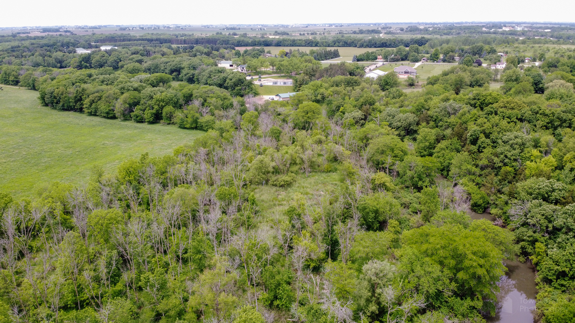 0 449th Road LaSalle, IL 61301 - Photo 8 of 12 a view of a lush green forest with trees and some houses