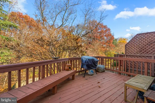 a view of balcony with wooden floor and seating space