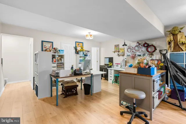 a view of a workspace with furniture and a livingroom