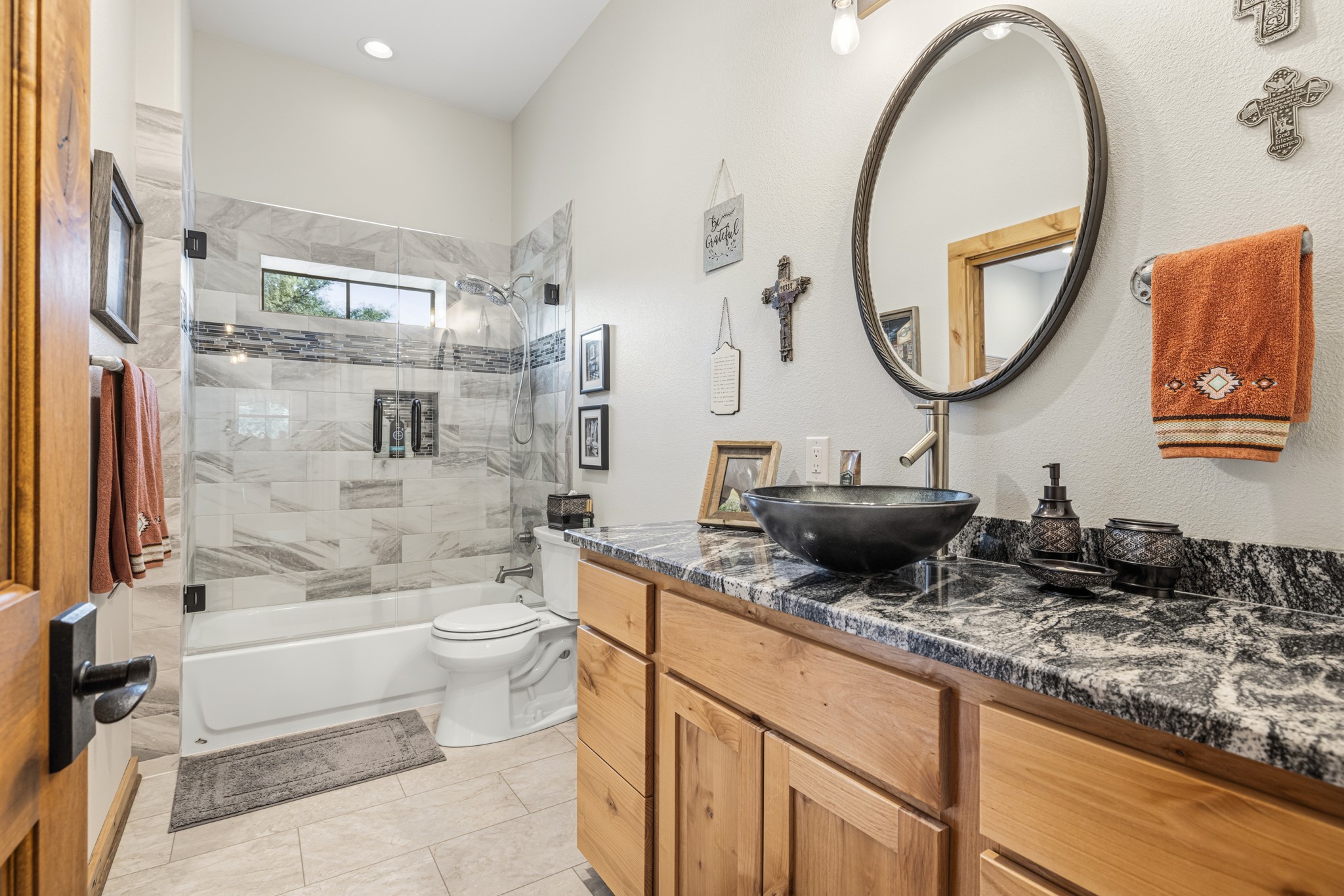 3724 Ranch Road 3347 Round Mountain, TX 78663 - Photo 15 of 40 a bathroom with a granite countertop sink mirror toilet and bathtub