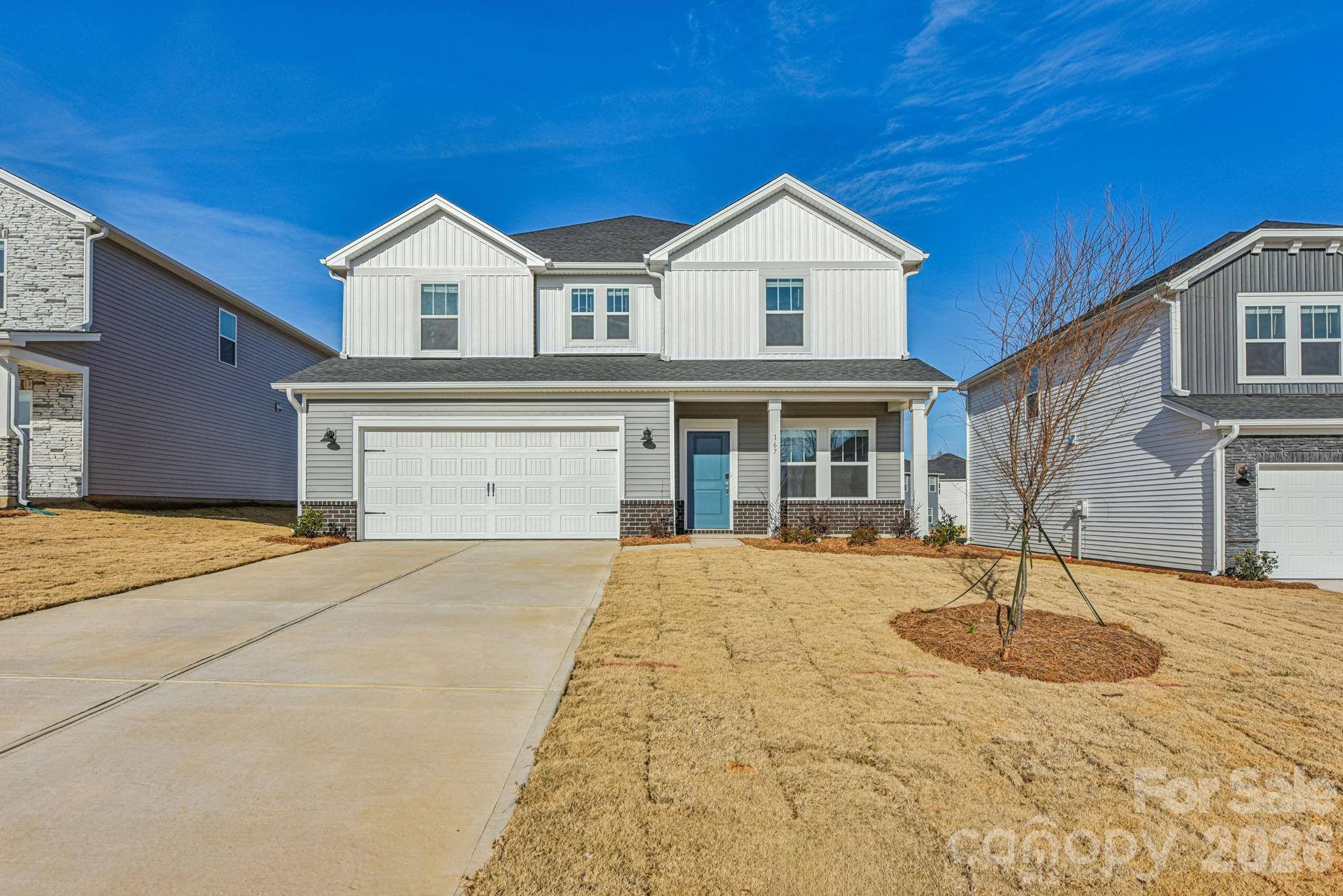 164 Murphy Mdw Road Mocksville, NC 27028 - Photo 1 of 12 a front view of a house with a yard and garage