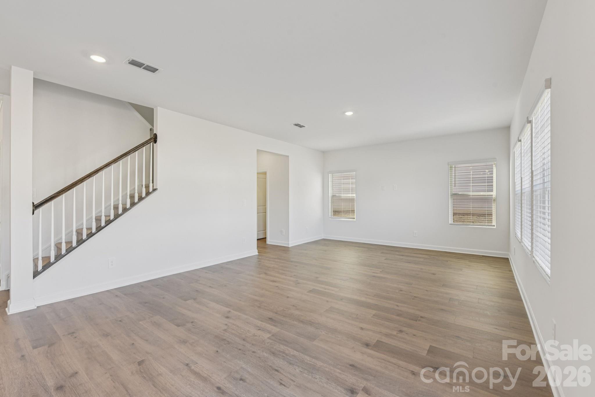164 Murphy Mdw Road Mocksville, NC 27028 - Photo 4 of 12 a view of an empty room with wooden floor