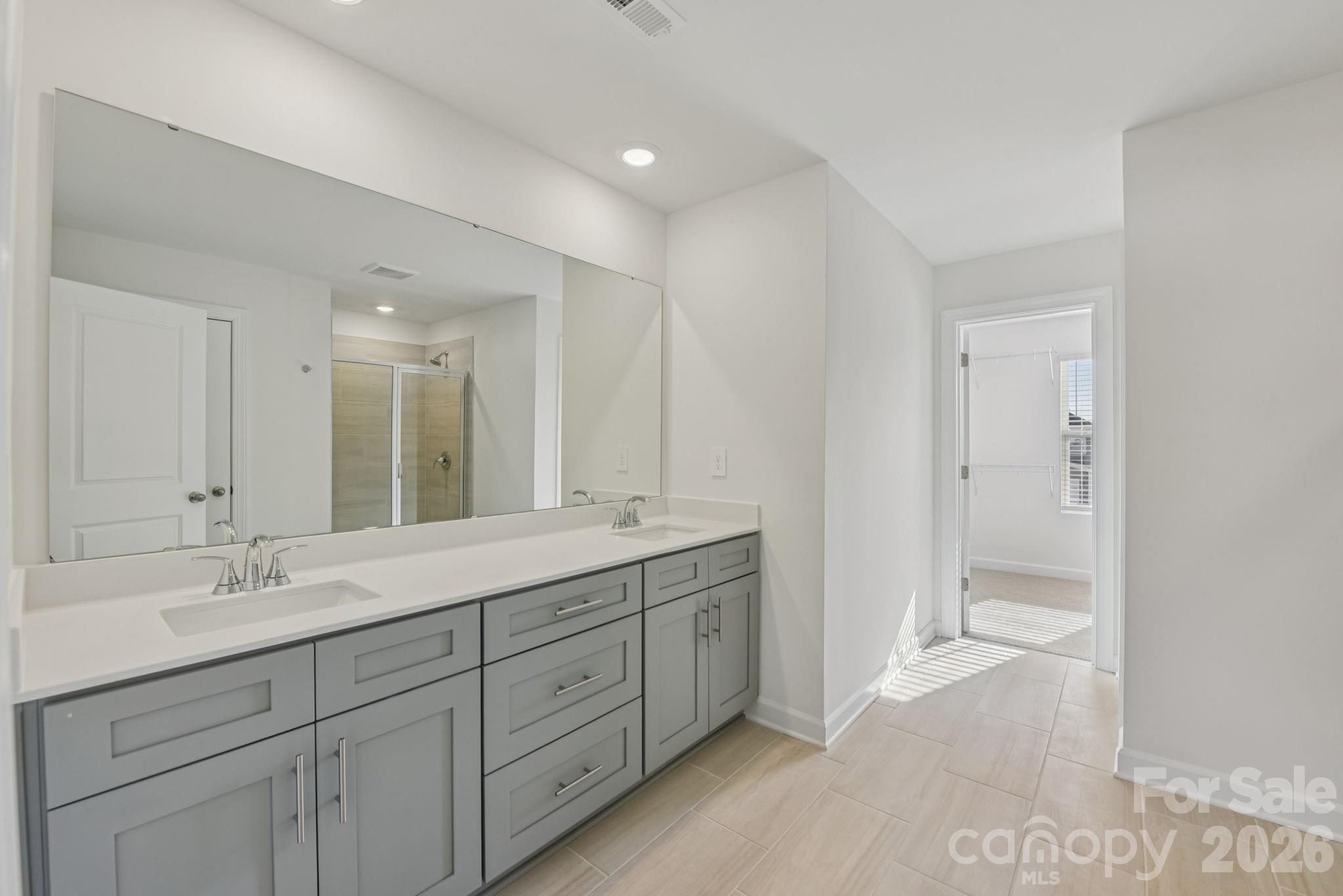 164 Murphy Mdw Road Mocksville, NC 27028 - Photo 9 of 12 a bathroom with a double vanity sink mirror and
