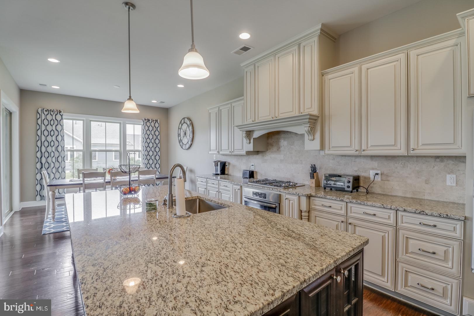 25372 Robin Tree Lane Ocean View, DE 19970 - Photo 6 of 61 Light Perimeter Cabinets & Accent Island