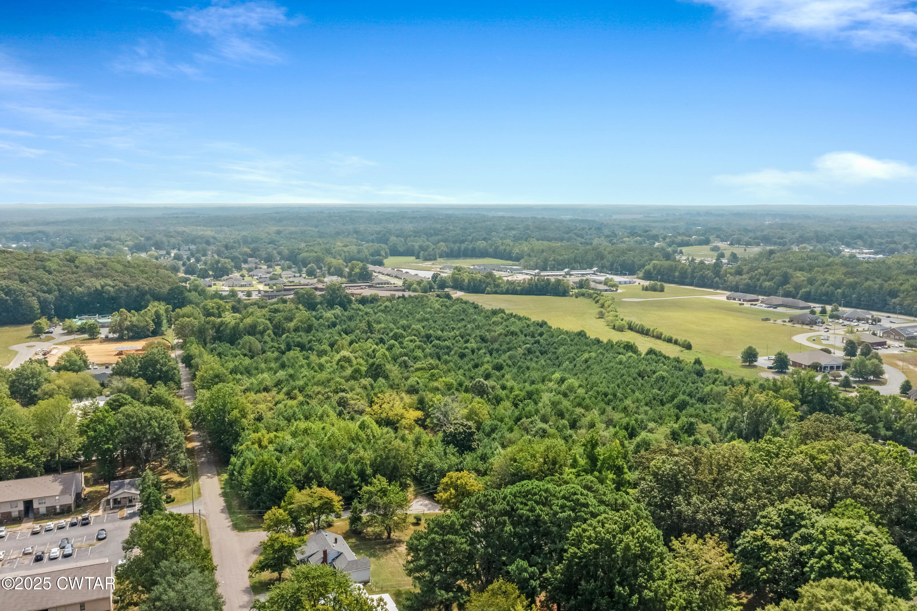1045 Manley Street Paris, TN 38242 - Photo 2 of 14 an aerial view of residential houses with outdoor space and ocean view