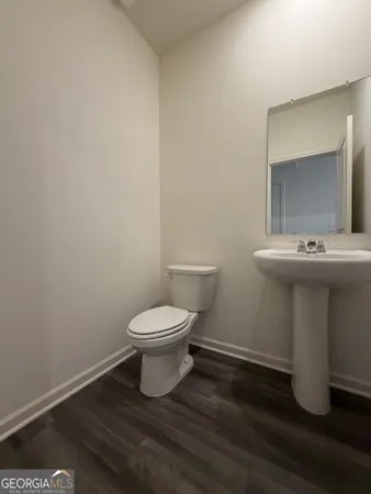 a bathroom with a toilet and a sink