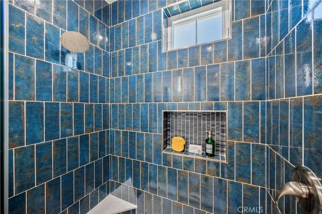 a bed room with a bed and a potted plant