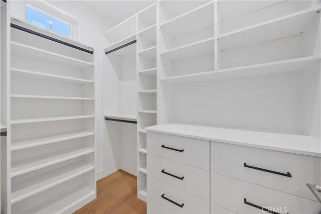 a bathroom with a sink a mirror and shower