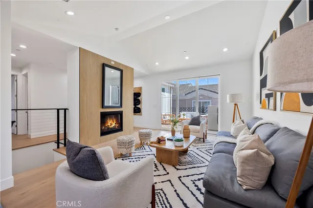 a living room with furniture fireplace and a flat screen tv