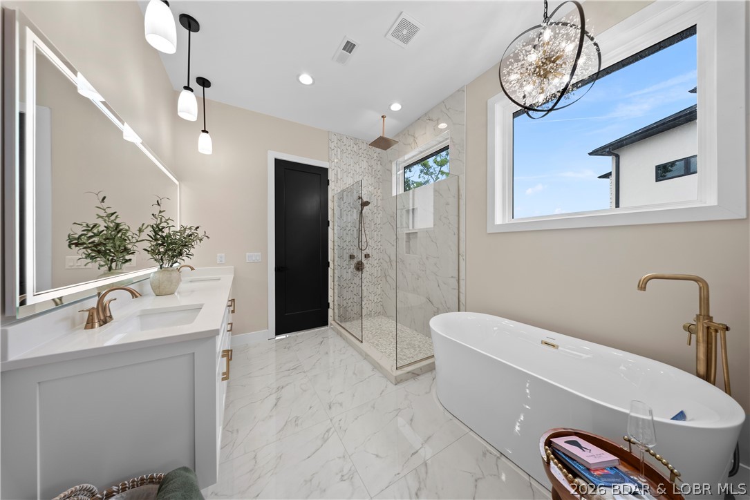 439 Red Bud Road Lake Ozark, MO 65049 - Photo 44 of 98 Bright and spacious luxury bathroom offering a fre