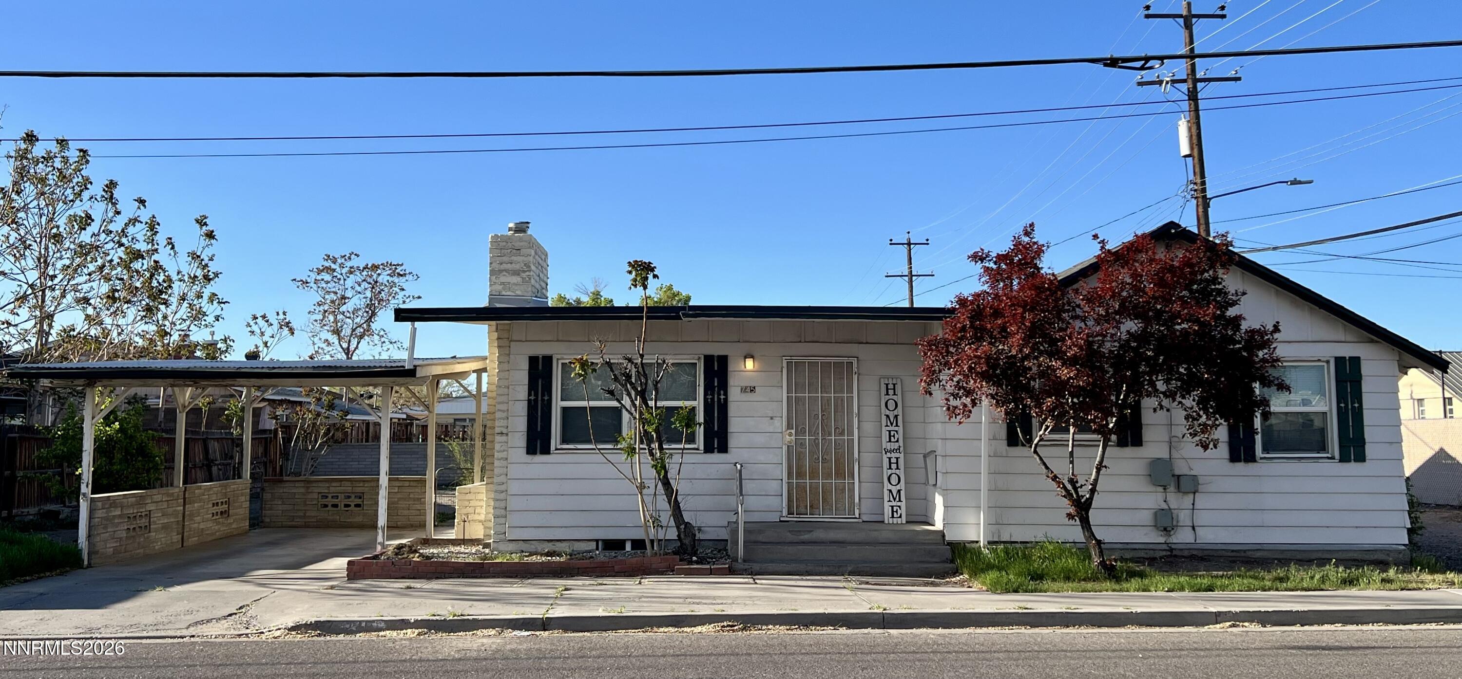 a view of a house with a iron stairs