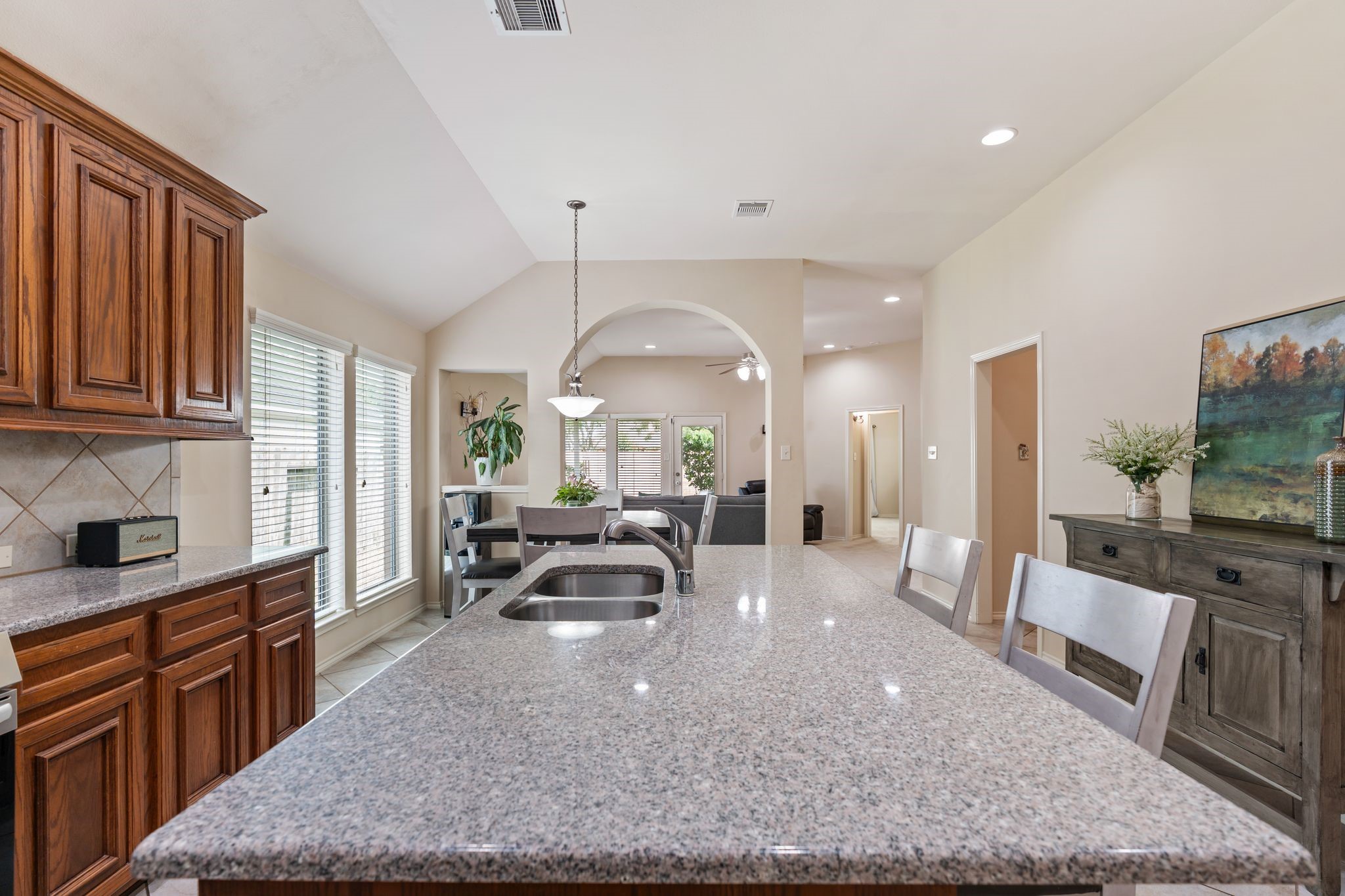 2606 Silverton Bend Rosenberg, TX 77471 - Photo 10 of 26 A large central island with bar seating anchors the kitchen, complemented by generous counter space throughout.
