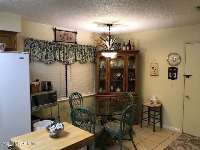 97076 Benchmark Avenue Yulee, FL 32097 - Photo 3 of 13 a table and chairs in a room
