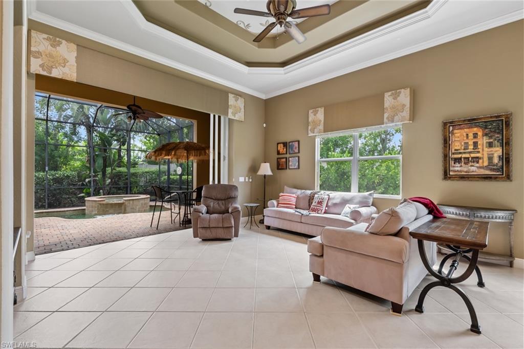 5757 Mango Circle Naples, FL 34110 - Photo 13 of 38 a living room with furniture and a large window