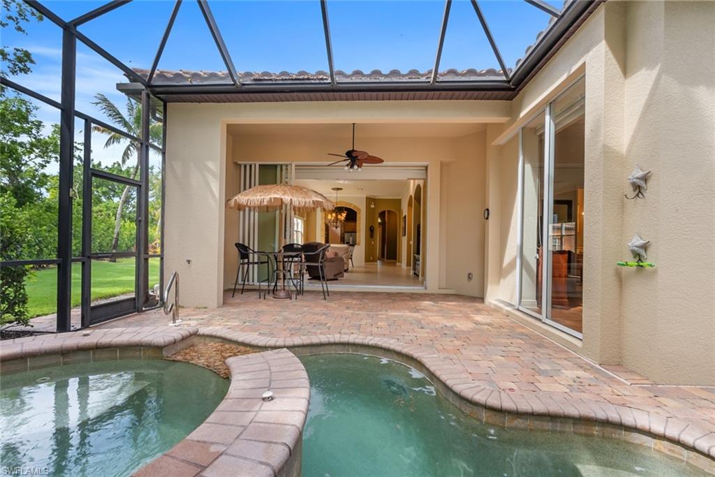 5757 Mango Circle Naples, FL 34110 - Photo 27 of 38 a view of a house with swimming pool