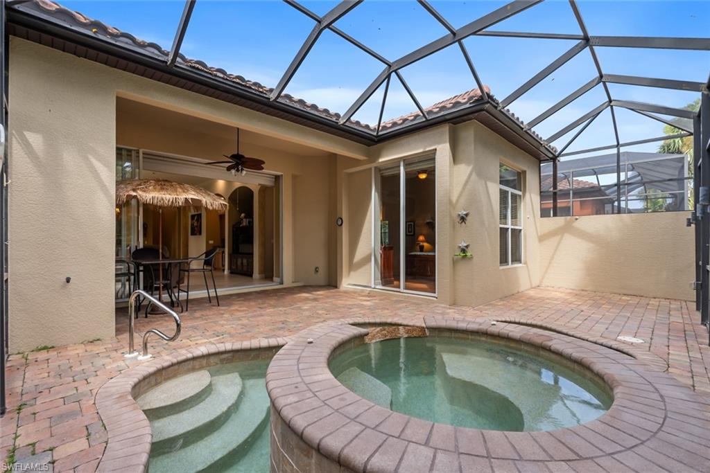 5757 Mango Circle Naples, FL 34110 - Photo 29 of 38 a swimming pool with outdoor seating