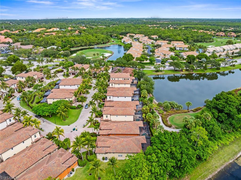 5757 Mango Circle Naples, FL 34110 - Photo 33 of 38 an aerial view of residential houses with outdoor space and trees