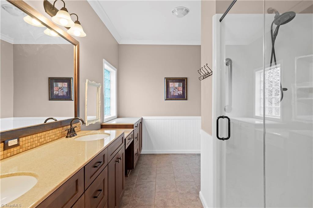 1607 Milling Road Mocksville, NC 27028 - Photo 24 of 38 Primary bath with double vanity and walk in shower.