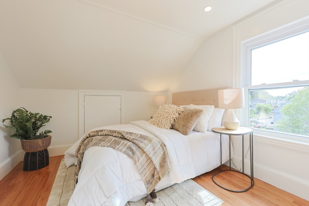 179 B Main Street, Unit B Medford, MA 02155 - Photo 16 of 40 a bedroom with a bed and a large window