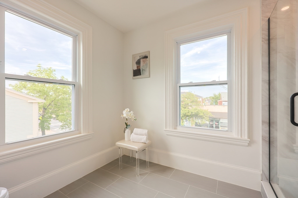 179 B Main Street, Unit B Medford, MA 02155 - Photo 26 of 40 a living room with furniture and a window