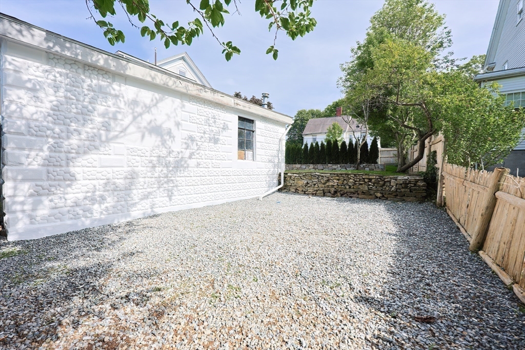 179 B Main Street, Unit B Medford, MA 02155 - Photo 38 of 40 a front view of a house with a yard