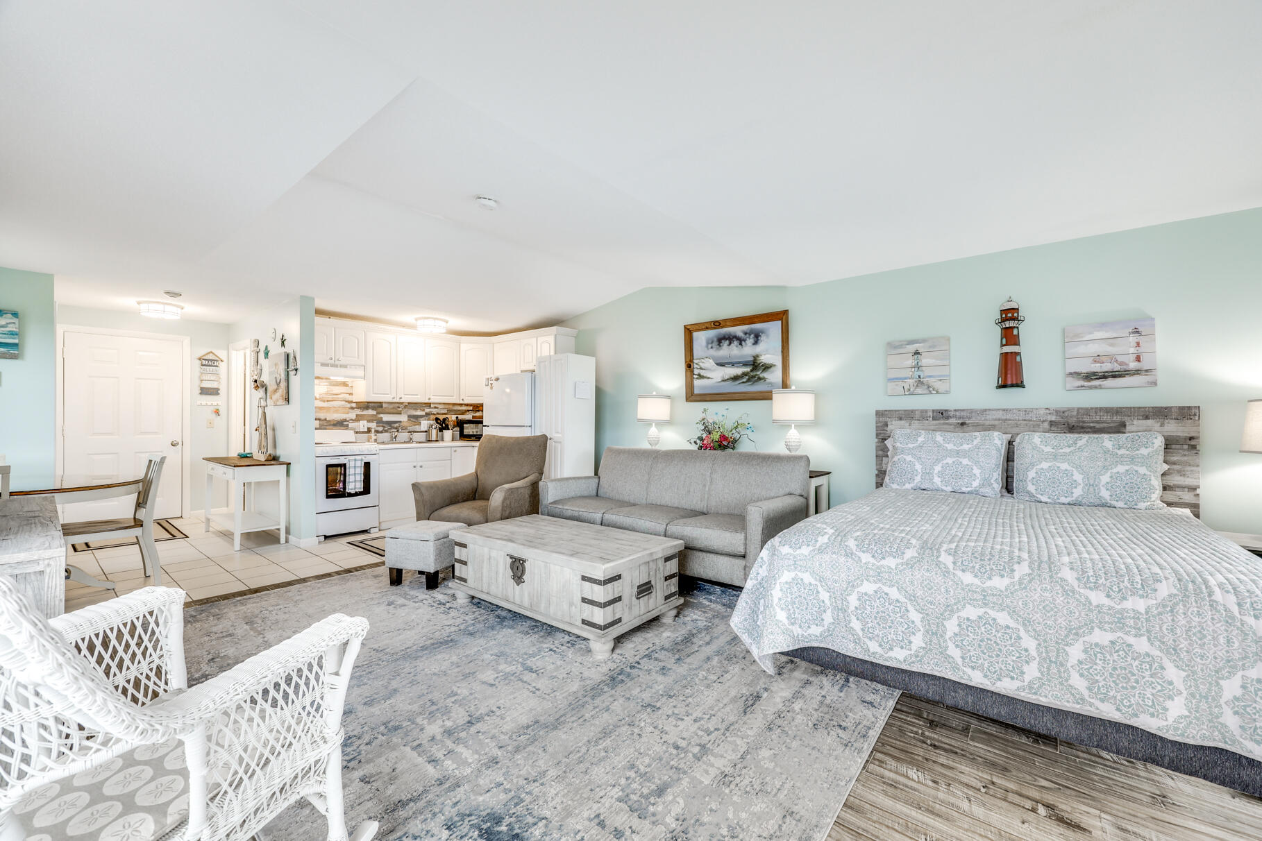 132 Shore Road, Unit 30 Truro, MA 02666 - Photo 14 of 32 a large bedroom with a bed and glass table