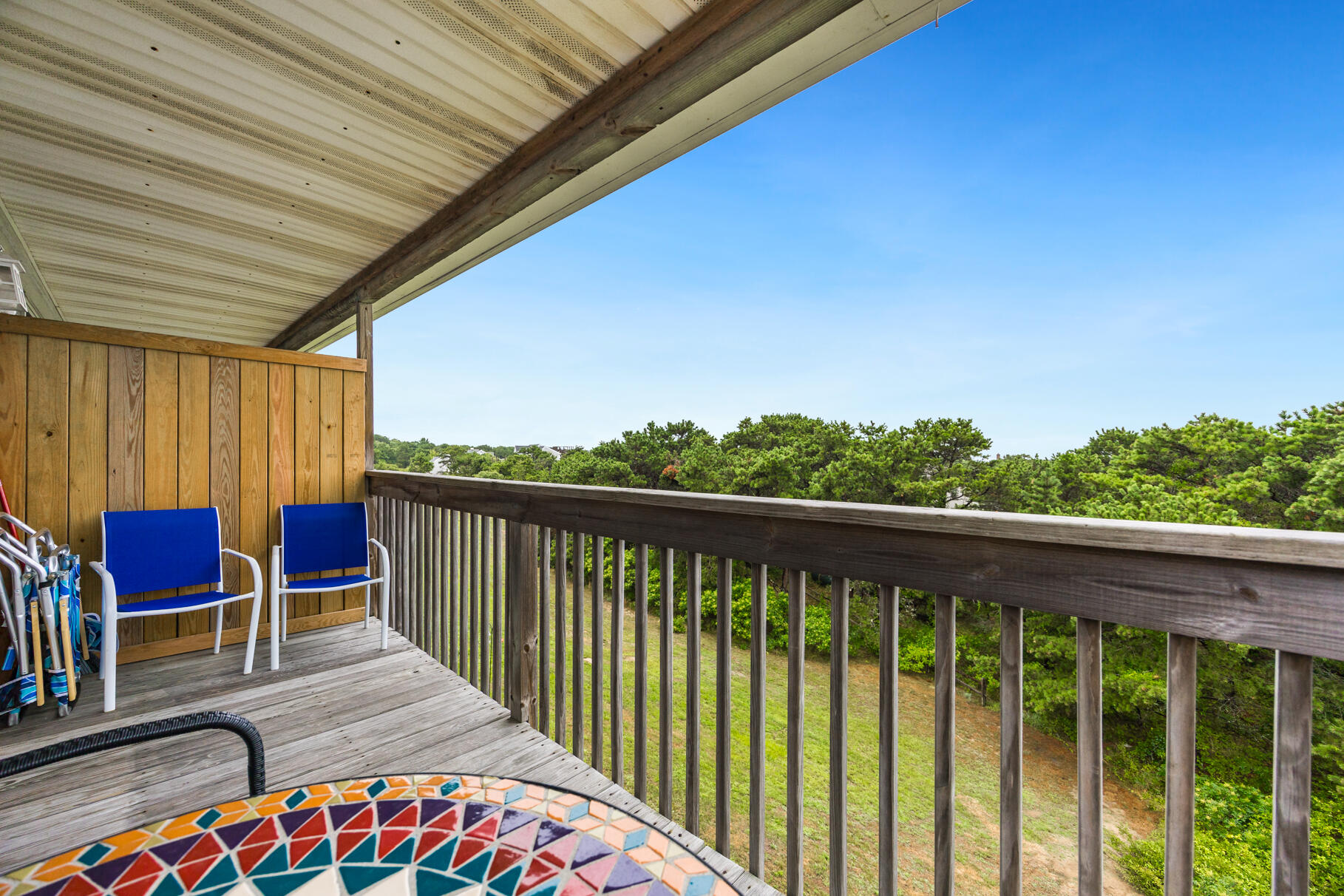 132 Shore Road, Unit 30 Truro, MA 02666 - Photo 17 of 32 a balcony with chairs