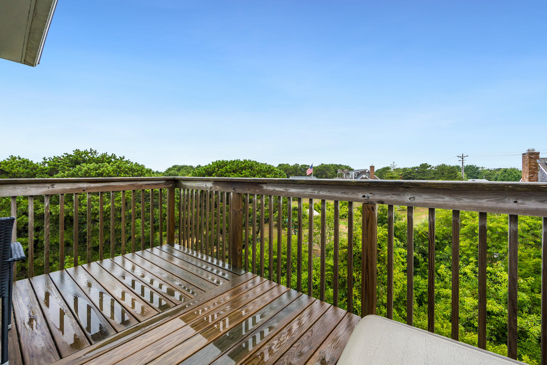 132 Shore Road, Unit 30 Truro, MA 02666 - Photo 6 of 32 a balcony with wooden floor and fence