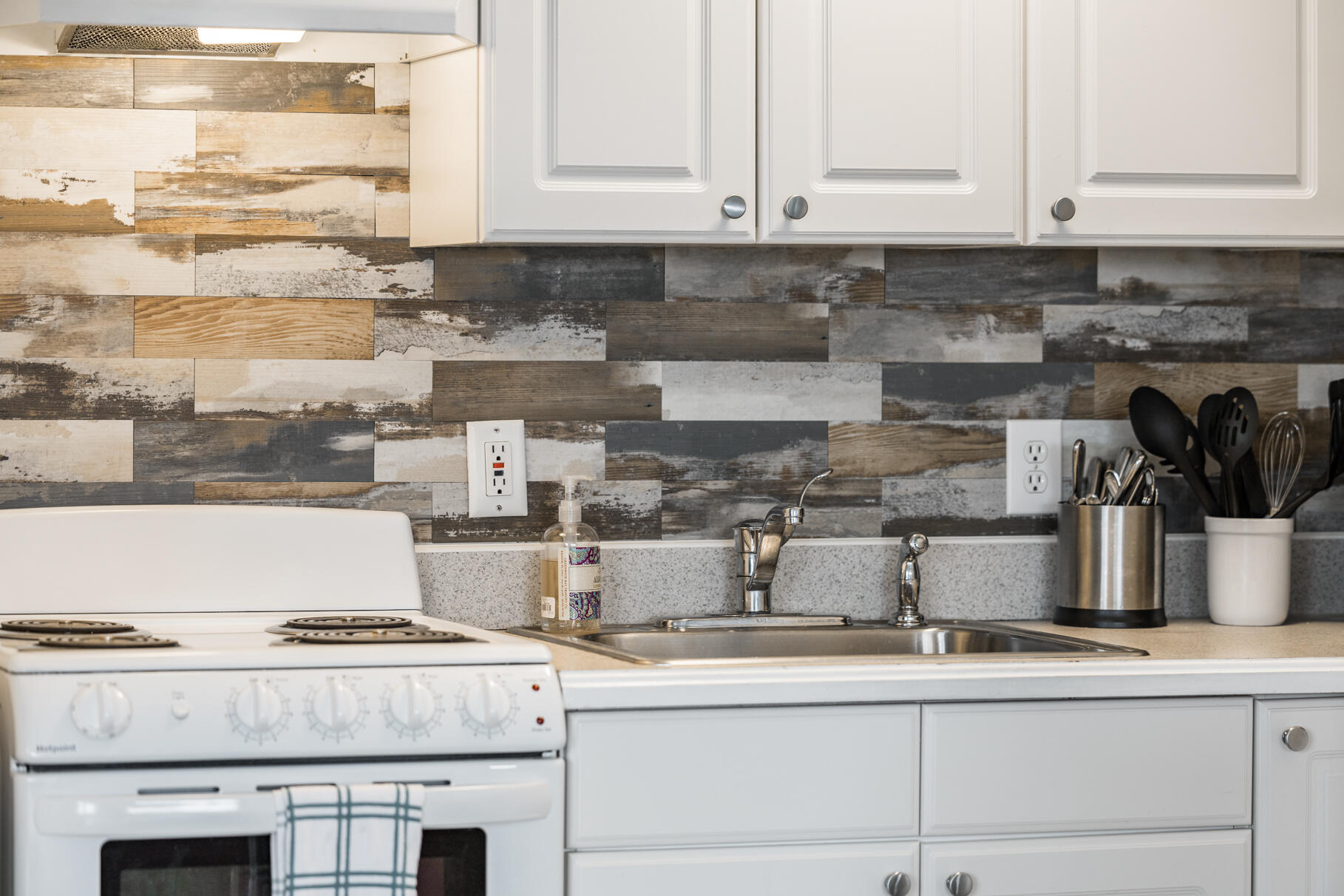 132 Shore Road, Unit 30 Truro, MA 02666 - Photo 10 of 32 a kitchen with a stove and cabinets