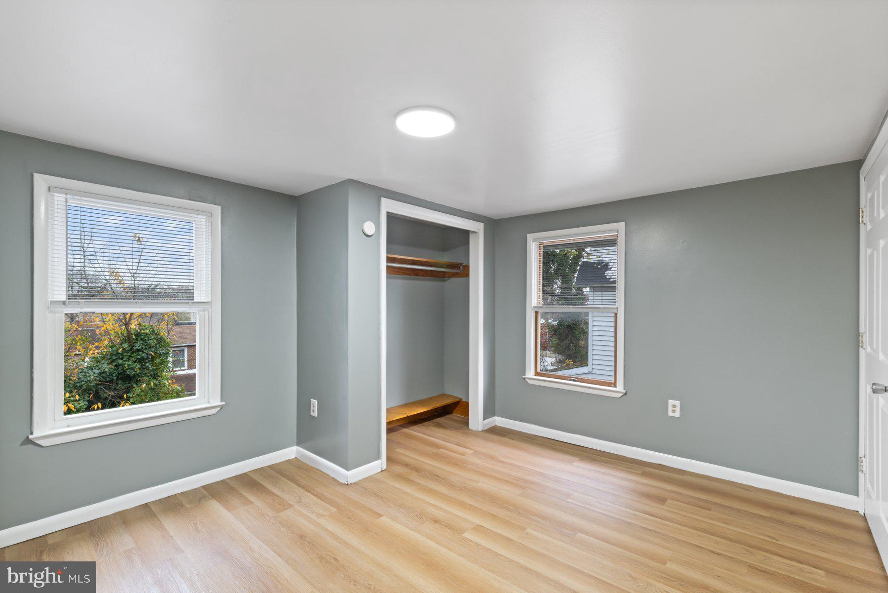 3700 7th Street Baltimore, MD 21225 - Photo 12 of 25 a view of an empty room with wooden floor and a window