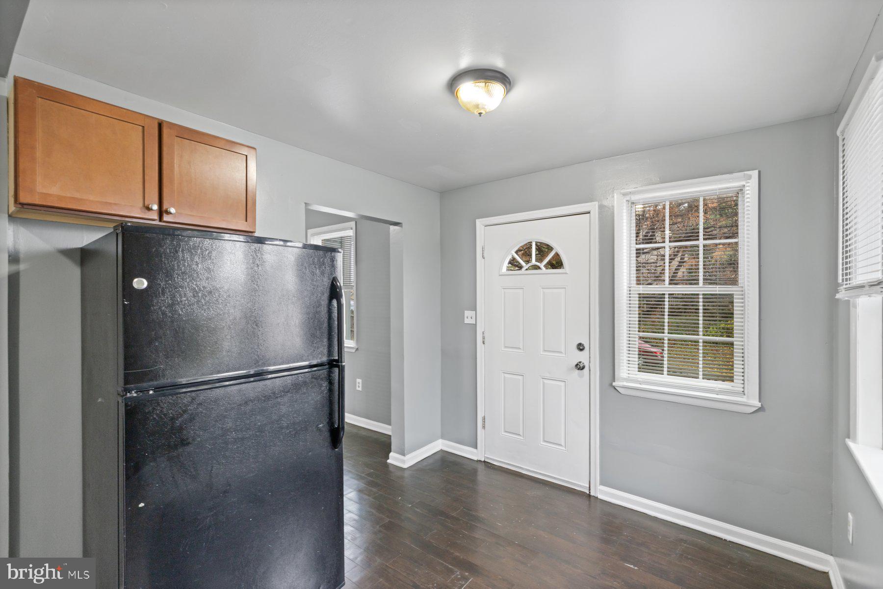 3700 7th Street Baltimore, MD 21225 - Photo 24 of 25 a view of empty room with wooden floor and windows
