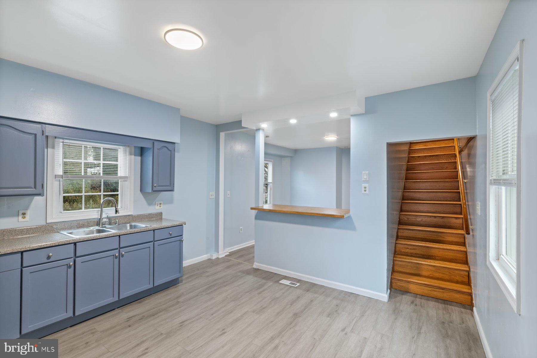 3700 7th Street Baltimore, MD 21225 - Photo 6 of 25 a view of a kitchen with a sink and windows
