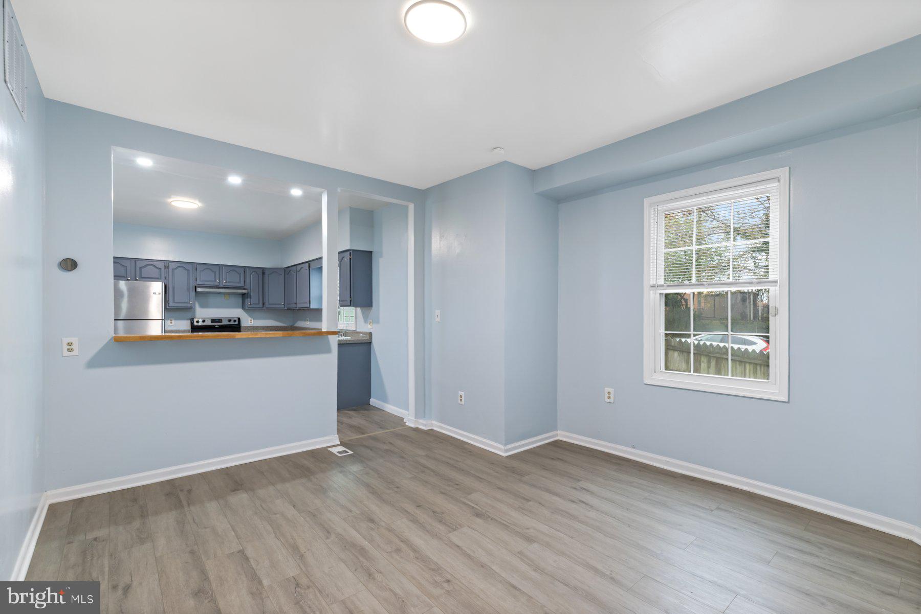 3700 7th Street Baltimore, MD 21225 - Photo 10 of 25 a view of kitchen with wooden floor