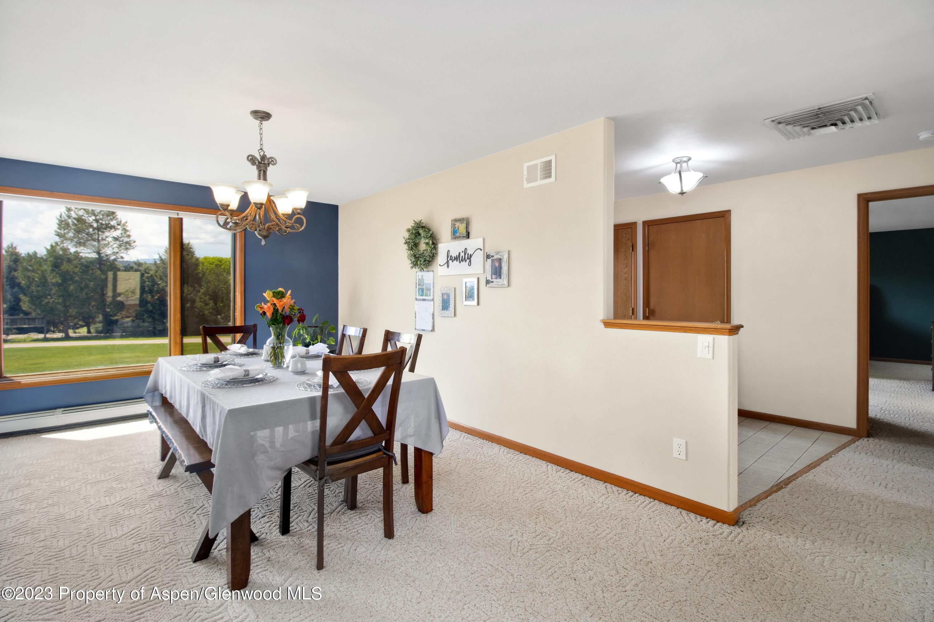 1840 County Road 293 Rifle, CO 81650 - Photo 15 of 27 a dining room with furniture and window