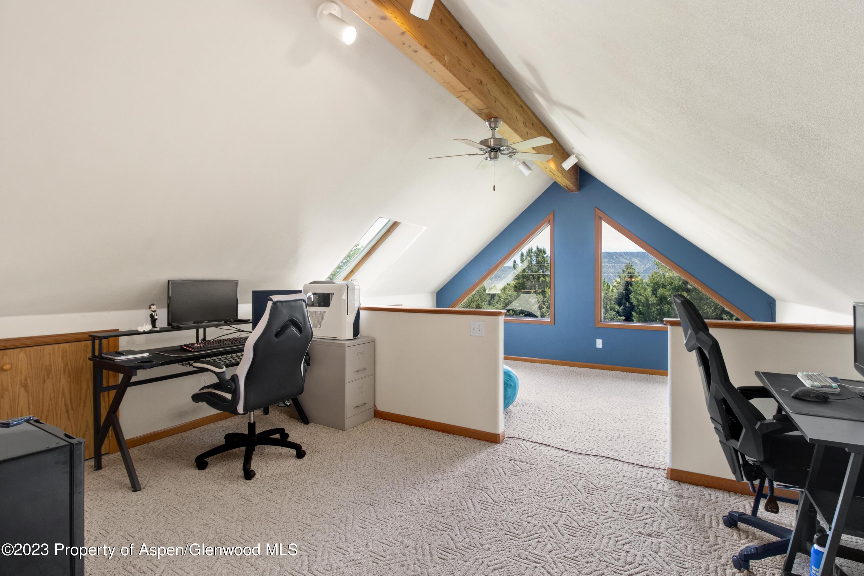 1840 County Road 293 Rifle, CO 81650 - Photo 18 of 27 a view of a workspace with furniture and a window