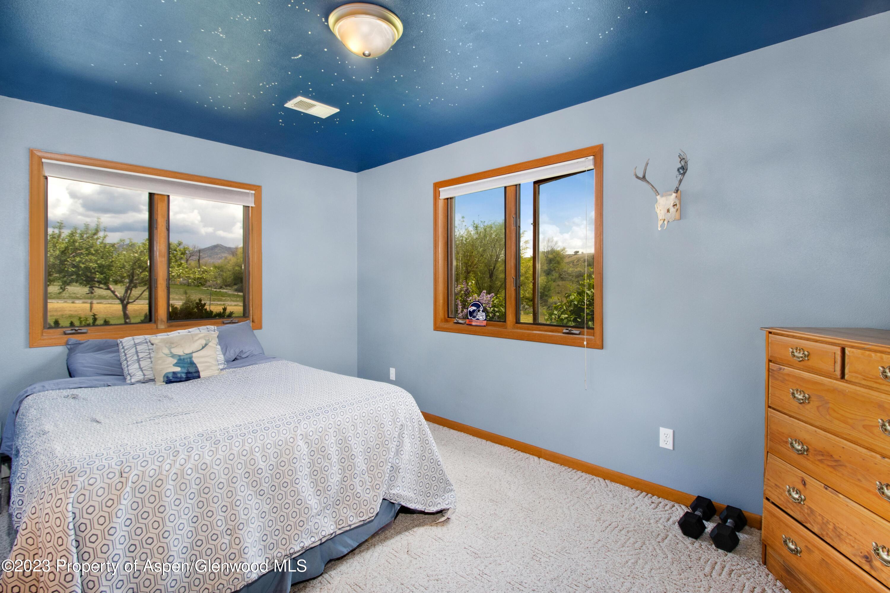 1840 County Road 293 Rifle, CO 81650 - Photo 20 of 27 a bedroom with a bed and window