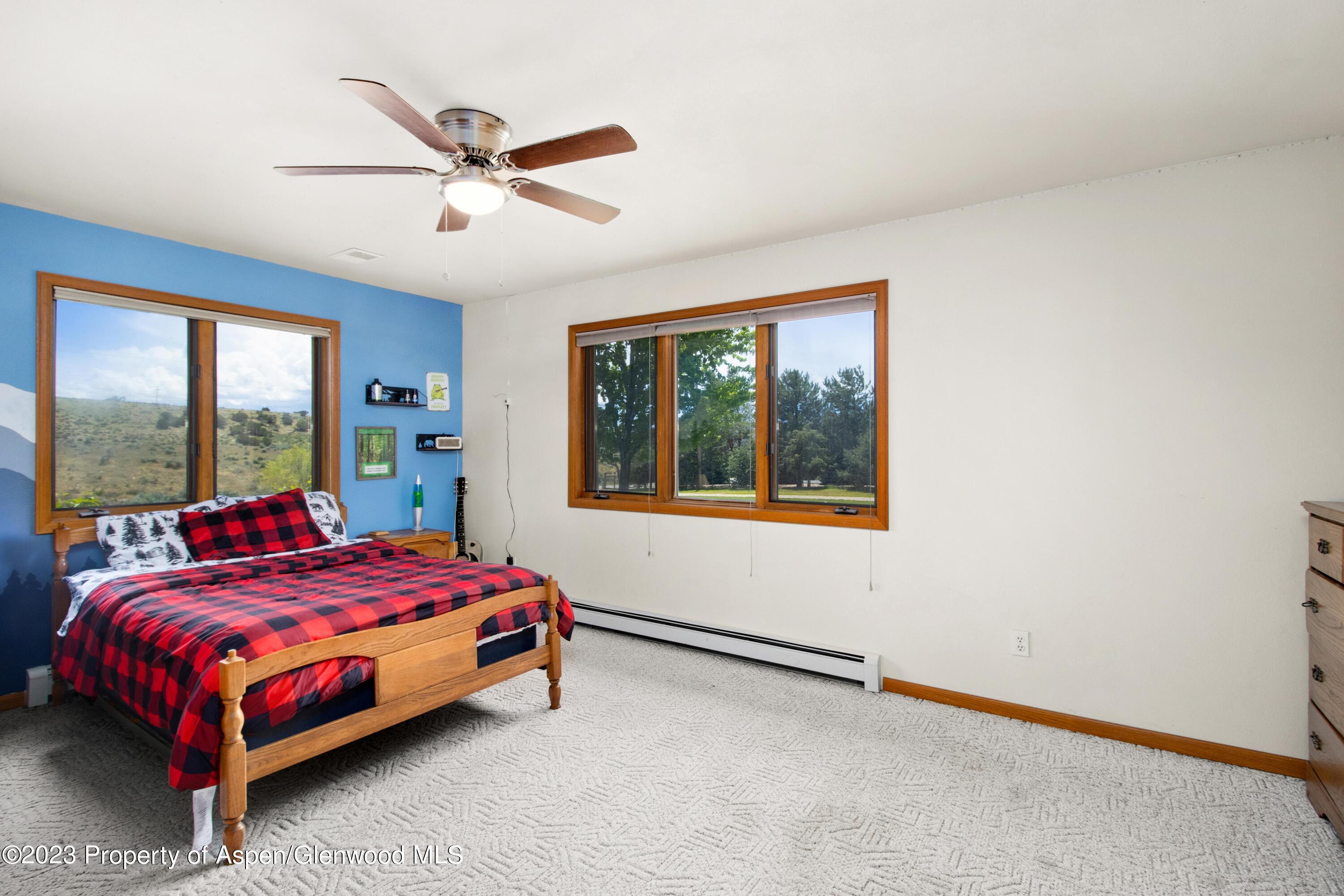 1840 County Road 293 Rifle, CO 81650 - Photo 22 of 27 a bedroom with a bed and window