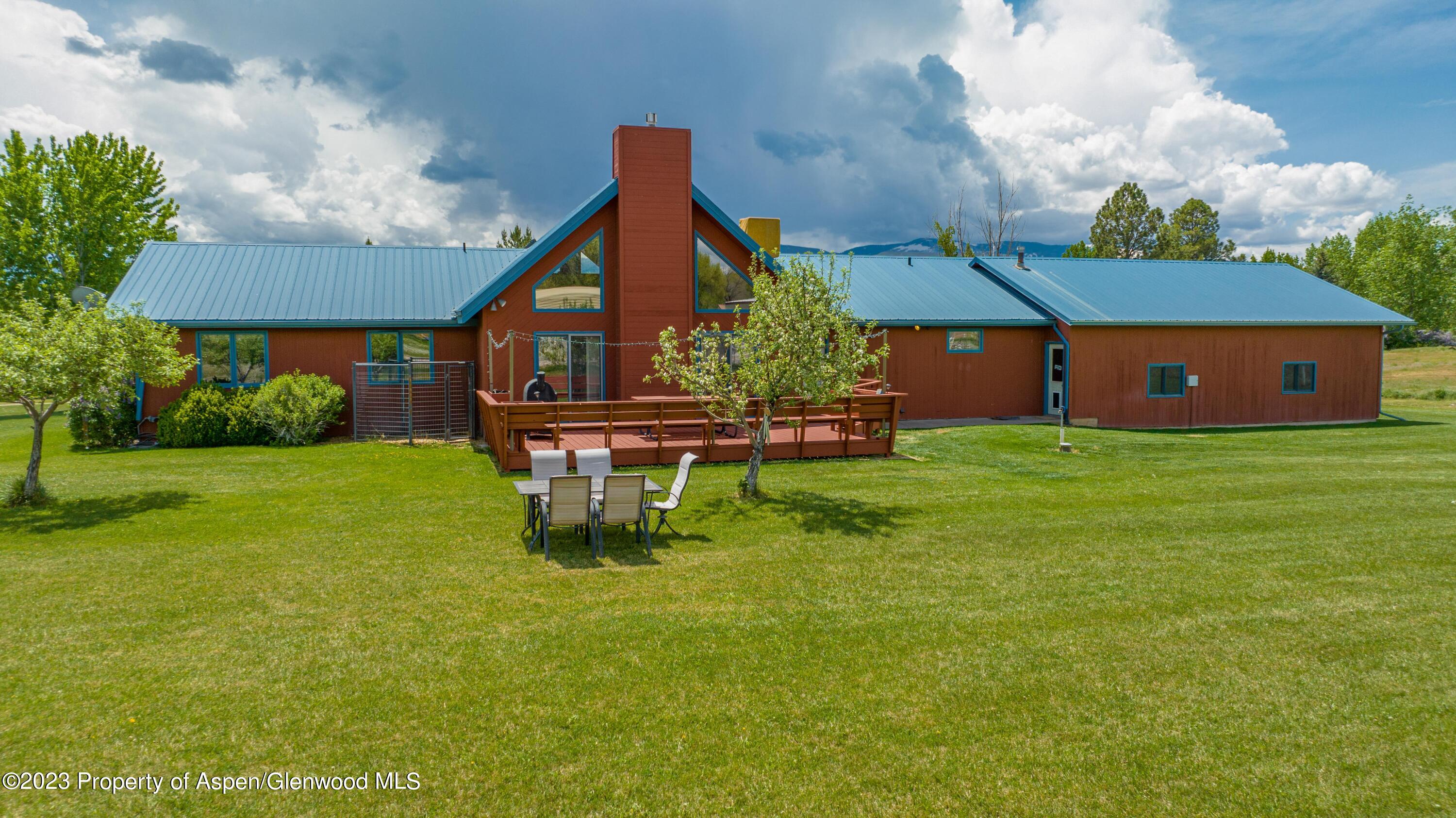 1840 County Road 293 Rifle, CO 81650 - Photo 6 of 27 a swimming pool with outdoor seating and yard
