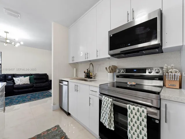 a kitchen with a stove and a microwave