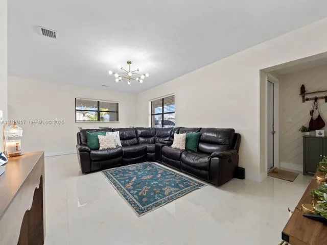 a living room with furniture and a couch