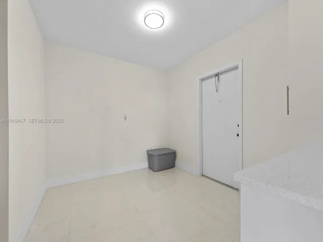 a bathroom with a sink toilet vanity and shower
