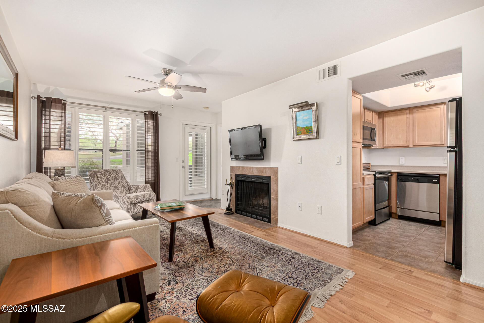 5855 North Kolb Road, Unit 8102 Tucson, AZ 85750 - Photo 27 of 28 a living room with furniture and a fireplace