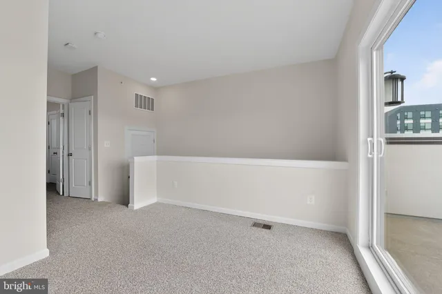 a bedroom with bed and window