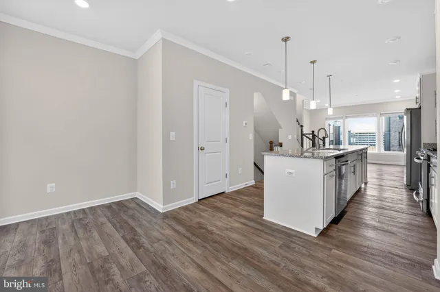 a view of kitchen with furniture and wooden floor