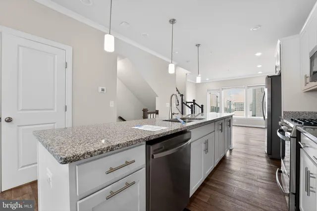 a bedroom with a bed and painting on the wall