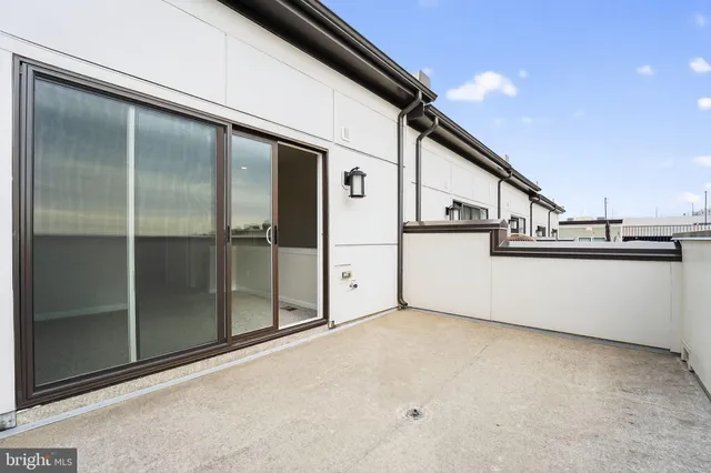 a front view of a building with many windows