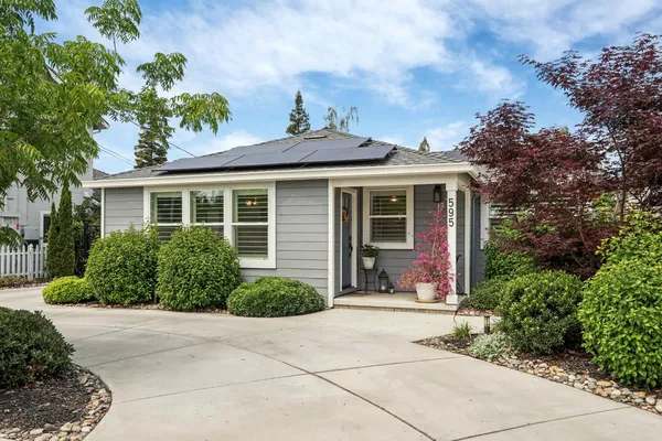front view of a house with a yard
