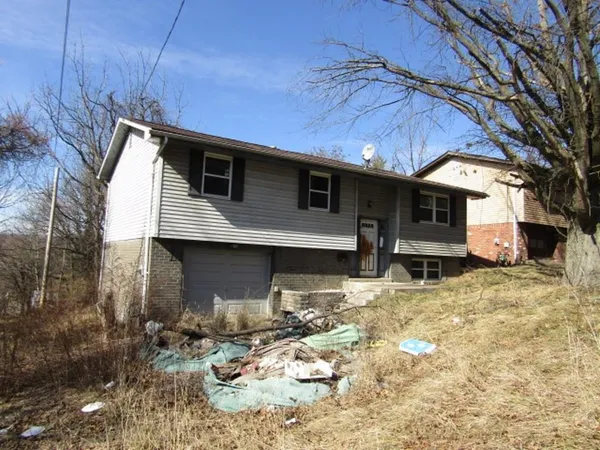 a view of a house with snow on the wall