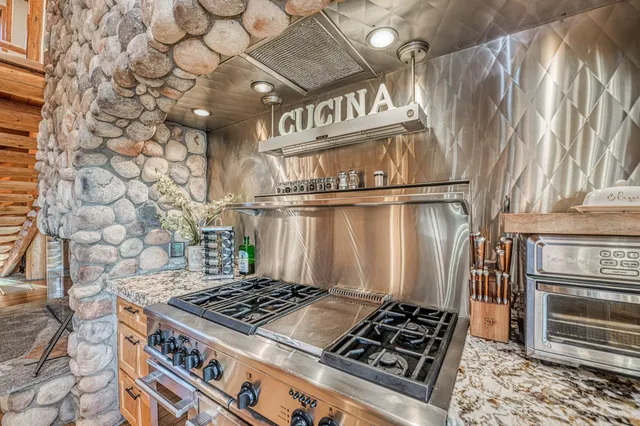 a view of a patio with table and chairs with wooden floor and fence
