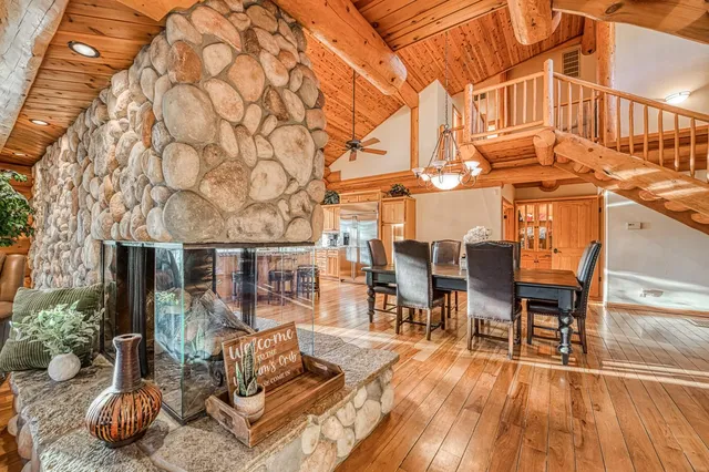 a bedroom with furniture and large window